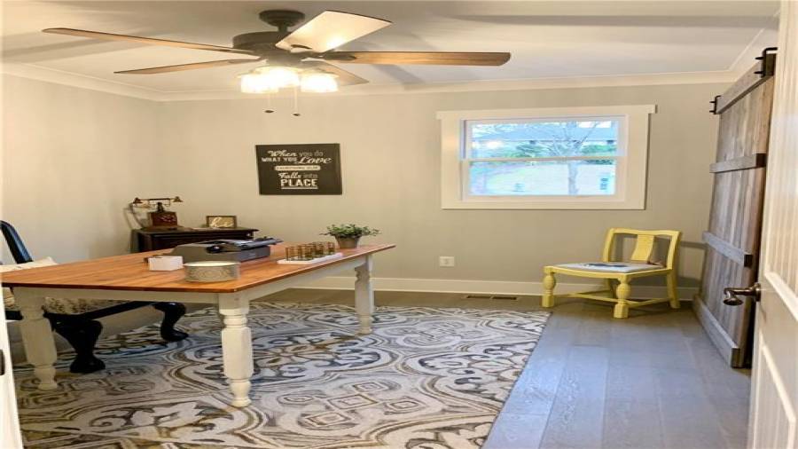 Guest bedroom on main level. Custom-made double sliding barn doors!