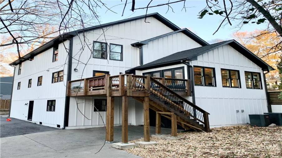Double French doors in dining and single door in kitchen lead to Large deck off back.
