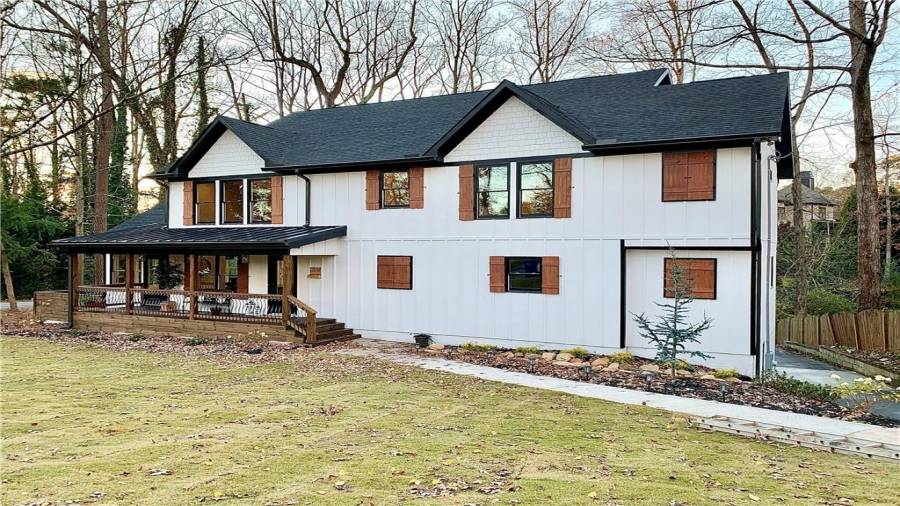 Custom-made cedar shutters & metal porch roof