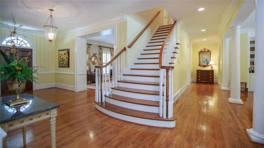 Main Staircase leads to 2nd floor with 4 Bedrooms, 3 Baths, Upstairs Den, Upstairs W/D and large walk in Attic Storage.