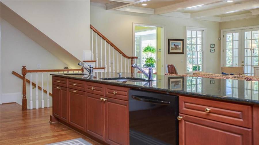 Back Staircase from second floor and down to finished Terrace Level below.