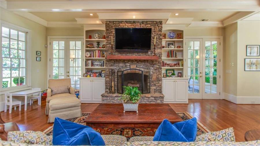 Wood Burning Fireplace with Gas Jet.  Wood Storage in Left Cabinet.  Cable/Sound System in Right Cabinet