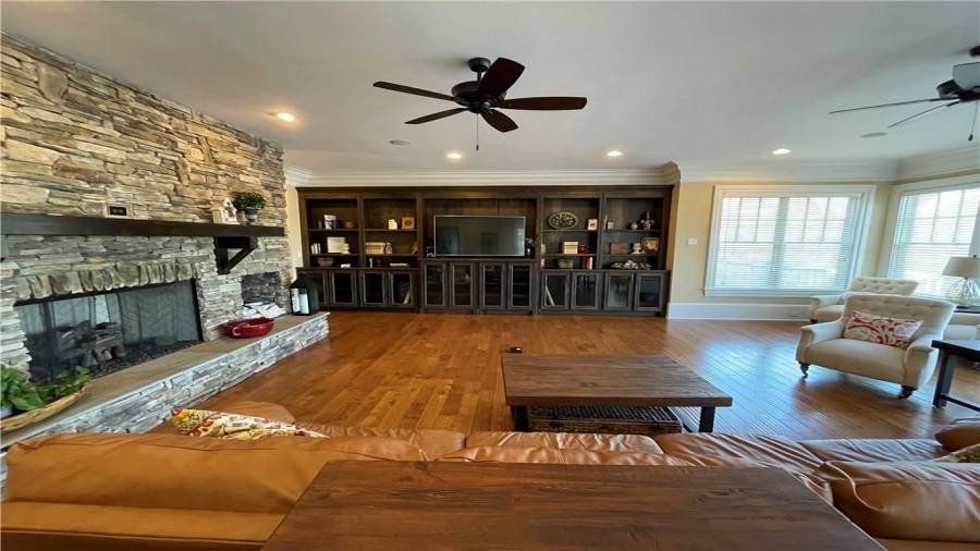 Oversized family room with built in book case, views to Lake Hartwell, and a gas fireplace!
