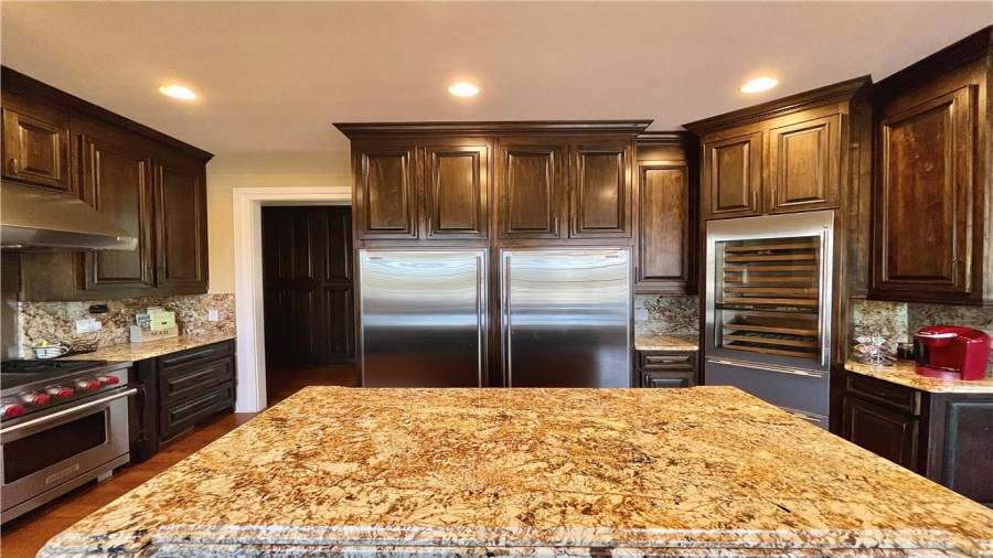 Right side = fridge, left side=freezer, built in wine rack, and a top of the line, red Keurig.