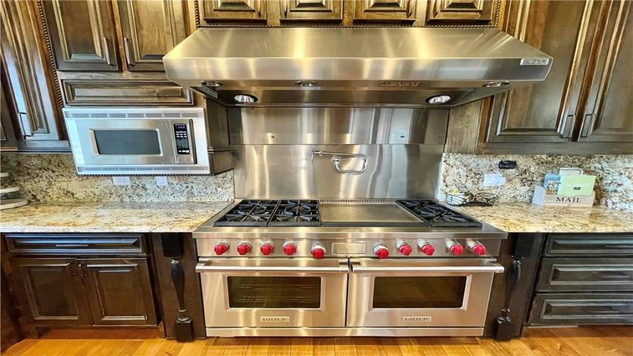 WOLF ??  double over with 6 gas burners, griddle, and filling pot extension.