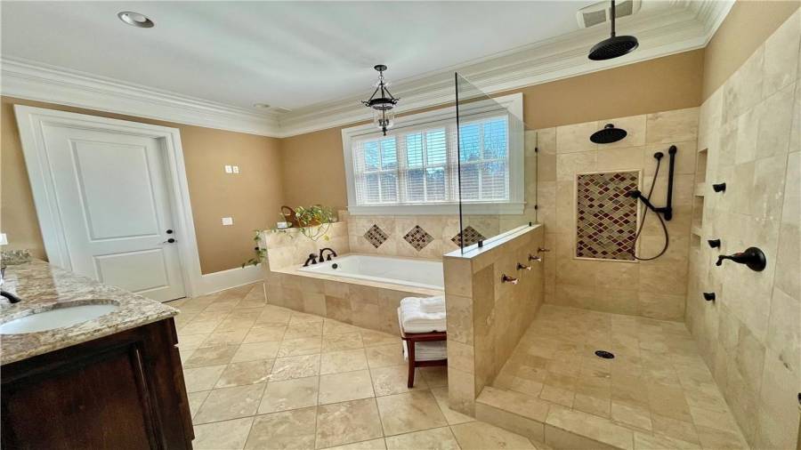 Her Master Bathroom with jetted stand up, rainfall shower with soaking tub!