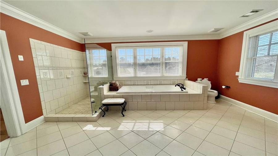 Sassafras full bathroom with soaking tub and stand up shower.