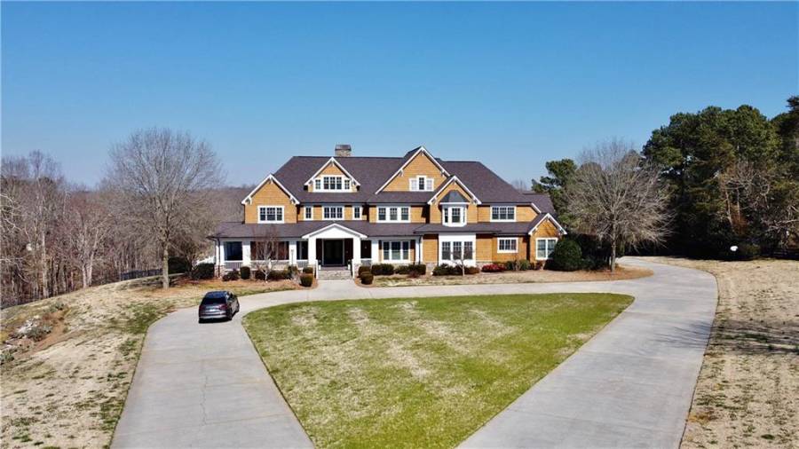 Wrap around drive in the front.  Two bay side entry garage on main level.