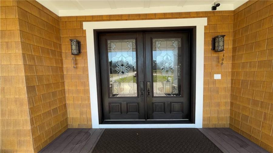 Gorgeous double doors greet you as you step on the porch.