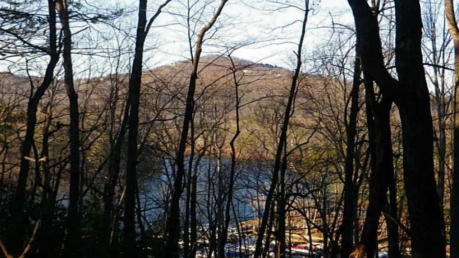 View. Huge 3 acre lot with views across lake to mountains