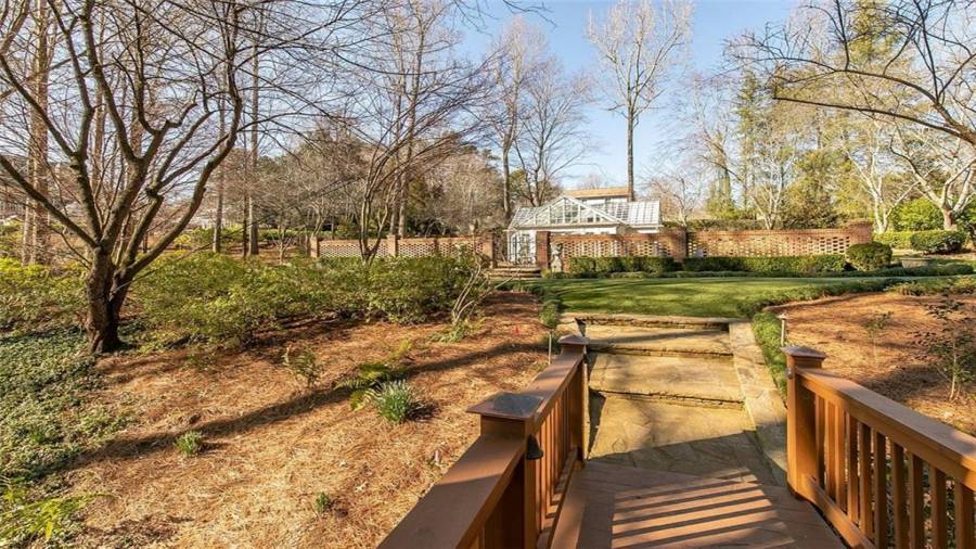 Bridge Leading from Green House Over Creek