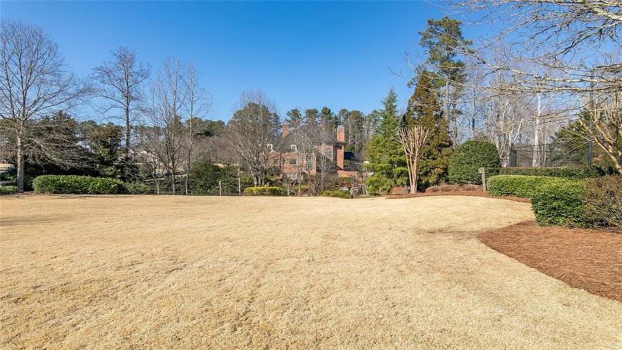 Side Yard/Recreation Area in Front of Tennis Courts