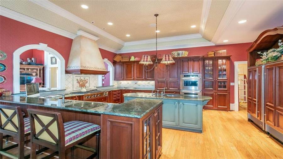 Kitchen Features Exotic Granite, Custom Cabinetry, and Stainless Steel Appliances