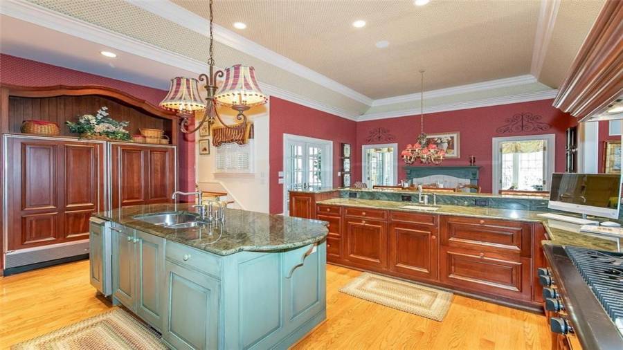 Sub-Zero Refrigerator and Freezer, Island with Sink (1 of 2 disposals in kitchen), and Built-in Ice Machine