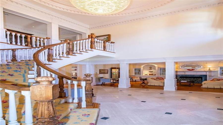 View from Foyer into Formal Sitting Room with Fireplace