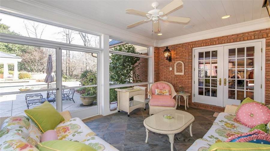Covered Back Porch Leading from Kitchen to Pool Area