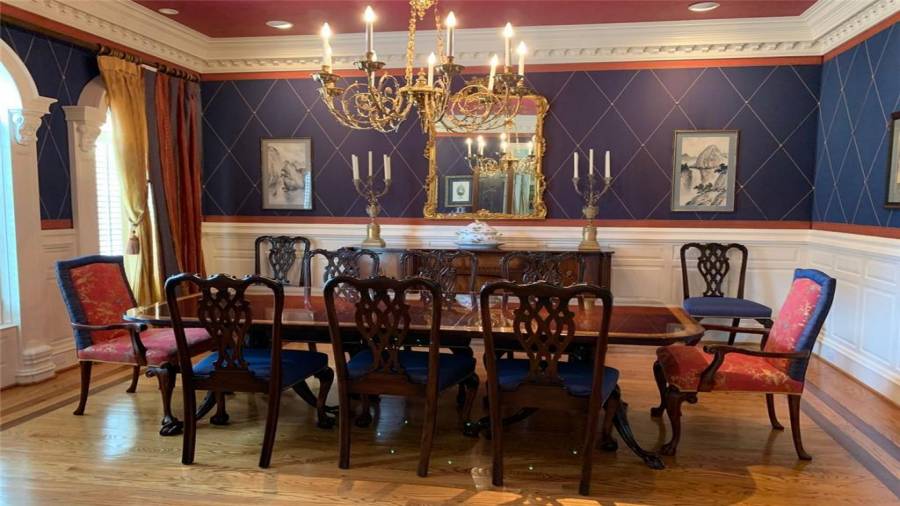 Formal Dining Room off of foyer with Custom Millwork and Chair-rail
