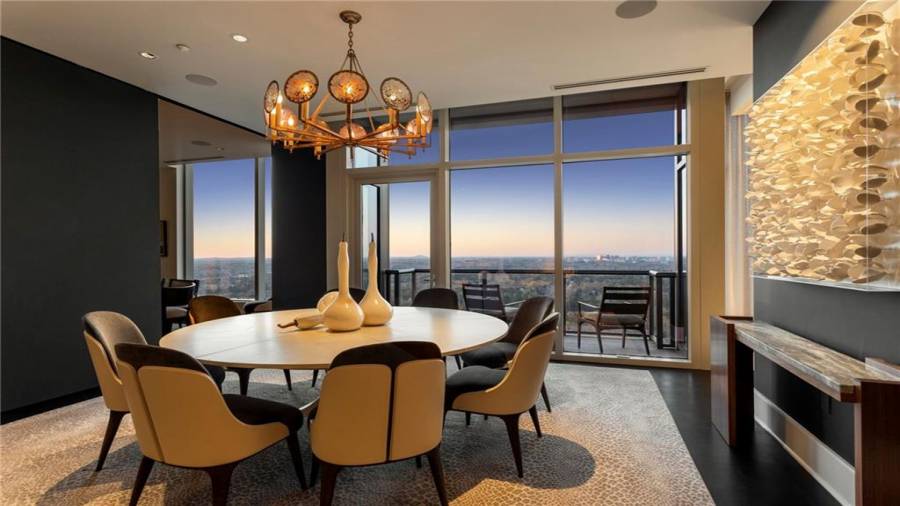 Magical views abound from the dining room. The Dining Room Seats 8 Comfortably and Offers A Sliding Privacy Wall Panel - To Separate it from the Breakfast Dining Room. Or, the Two rooms can be combined for larger dinner parties - with seating at both tables.