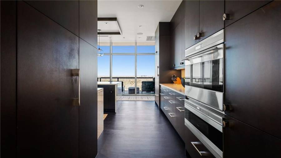The Walk-In Pantry Is On The Left. The Kitchen Features a 48