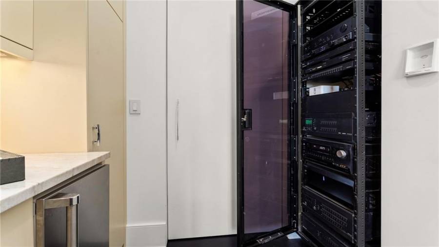 The Crestron Home Automation System is State-Of-The-Art And Controls AV, Window Shades, Lighting, Etc.