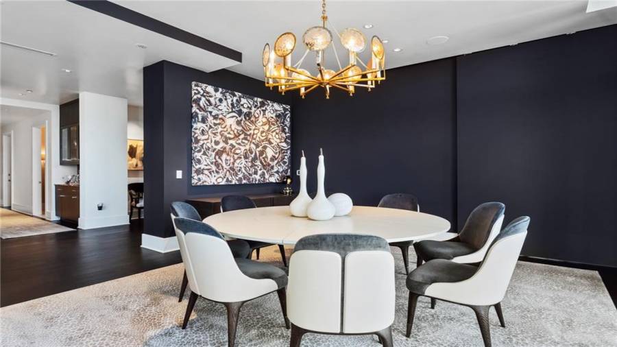 The Dining Room Seats 8 Comfortably and Offers A Sliding Privacy Wall Panel - To Separate it from the Breakfast Dining Room. Or, the Two rooms can be combined for larger dinner parties - with seating at both tables.