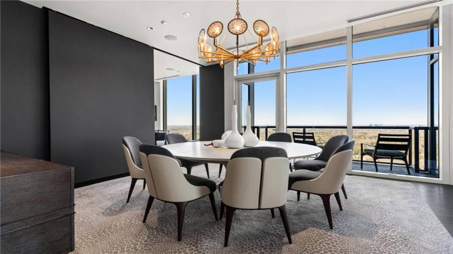 The Dining Room Seats 8 Comfortably and Offers A Sliding Privacy Wall Panel - To Separate it from the Breakfast Dining Room. Or, the Two rooms can be combined for larger dinner parties - with seating at both tables.