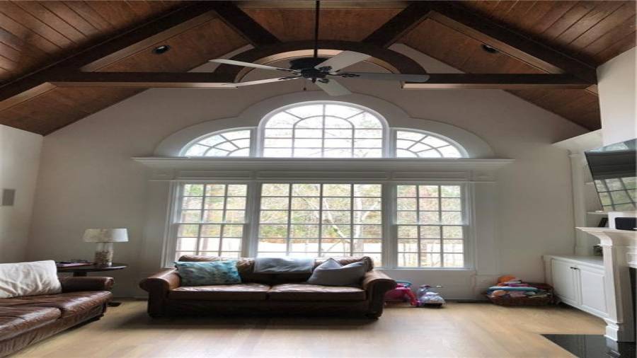 Two Story family room with built-ins and tons of natural light.